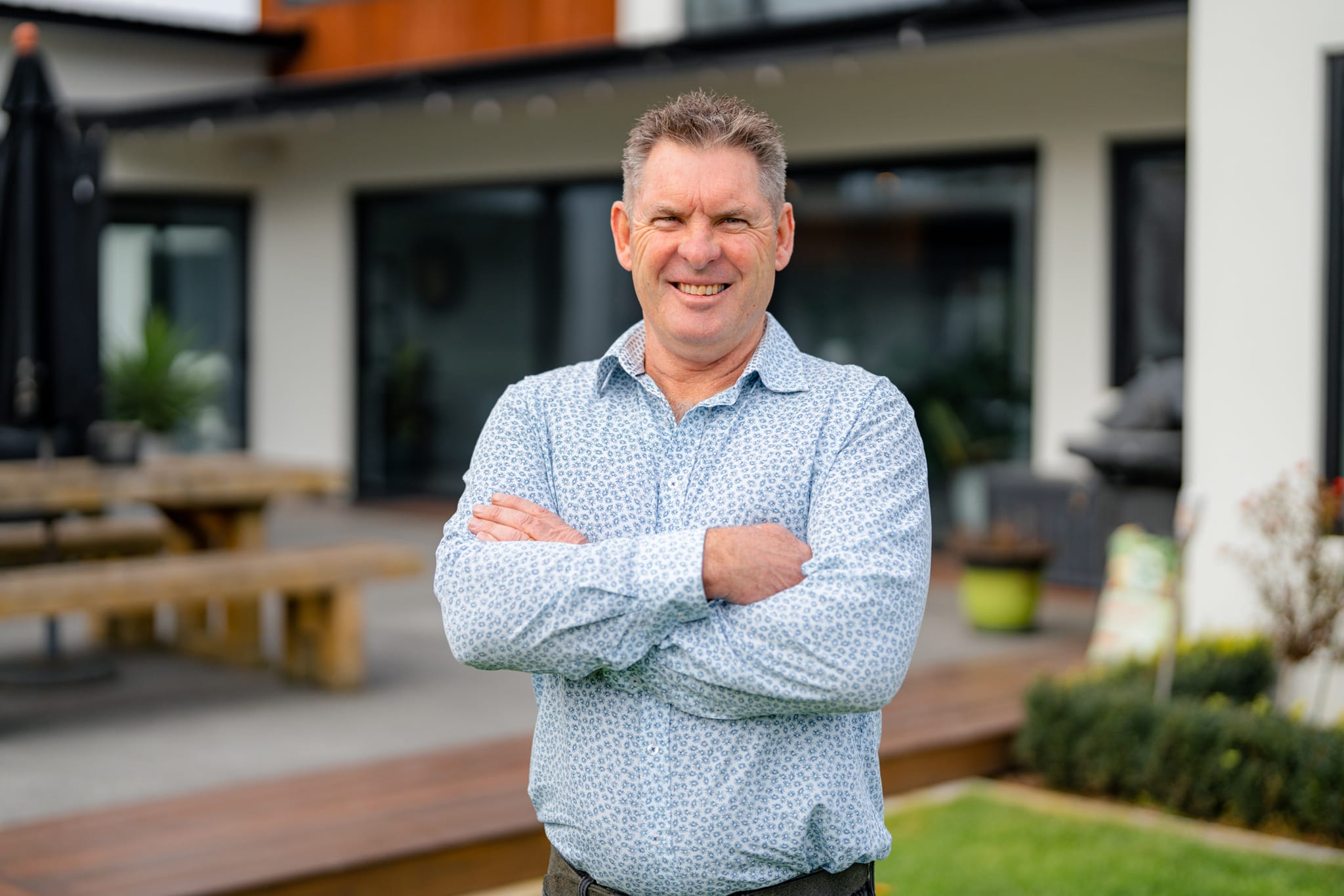 Brent from Stanton Builders standing proudly outside a newly completed bespoke home build in Canterbury.