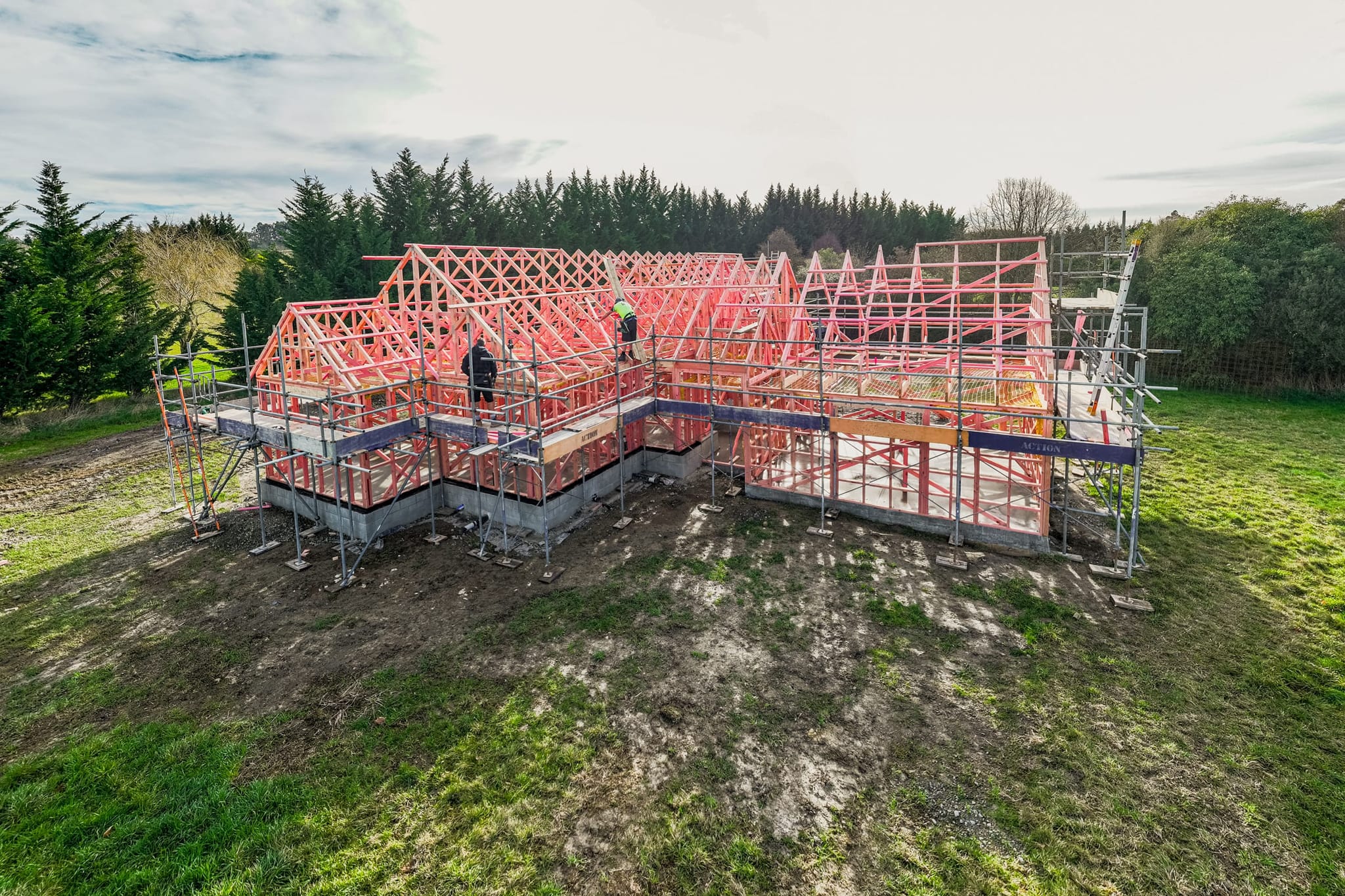Timber roof framing and scaffolding on a bespoke architectural new build by Stanton Builders, trusted renovation builders.