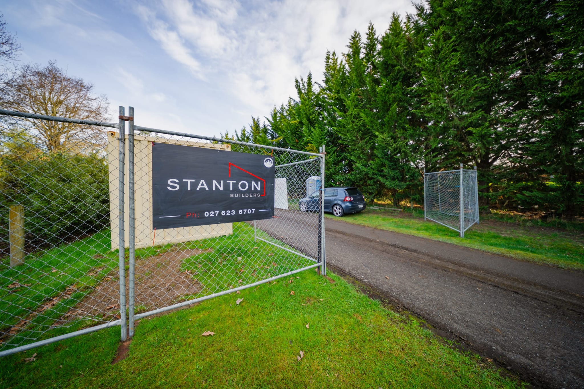 Stanton Builders site entrance with signage, highlighting their work in kitchen renovations, bathroom renovations, and new home construction.