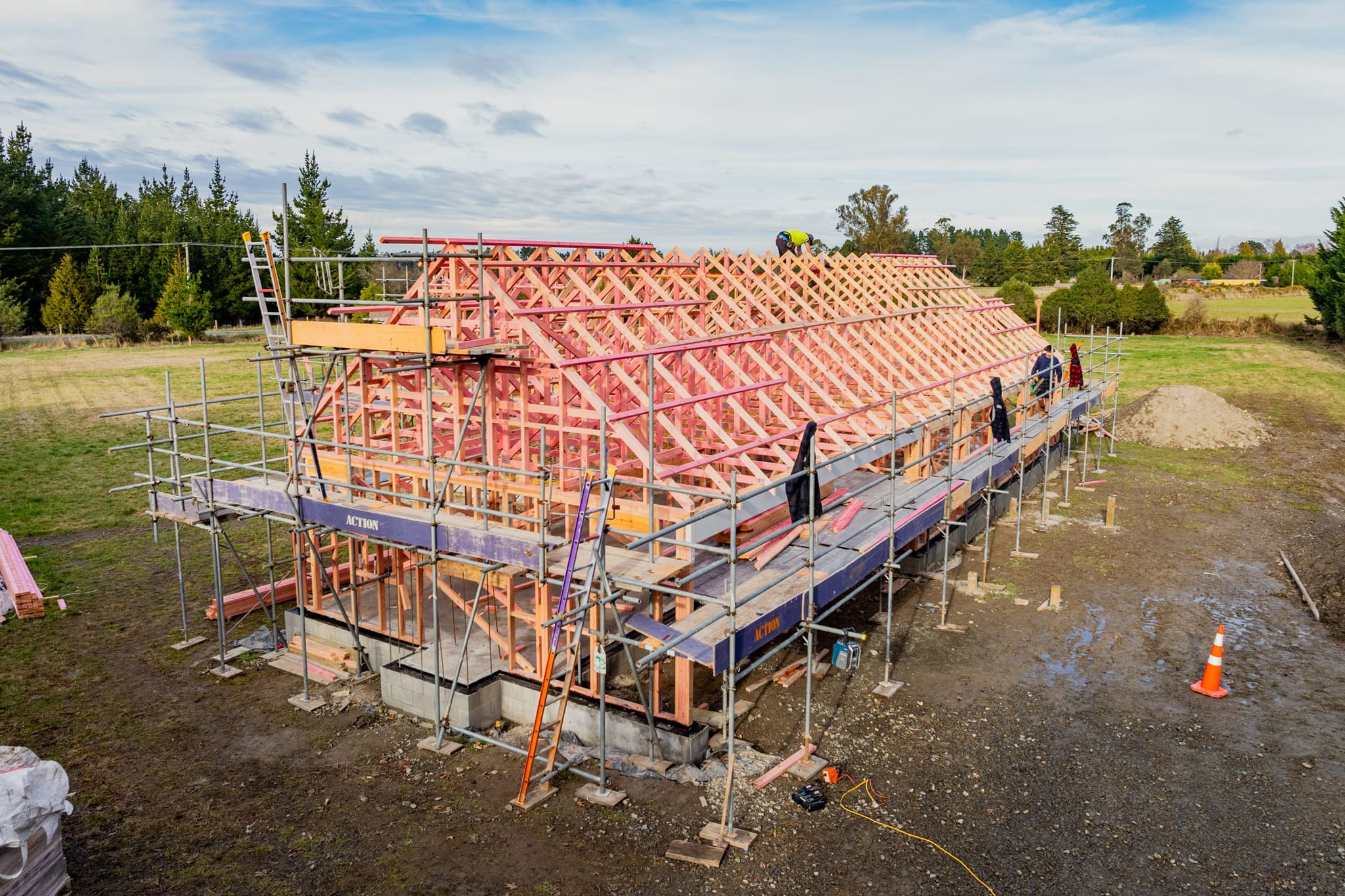 Master builders installing timber trusses during a kitchen renovation and home build in Loburn.