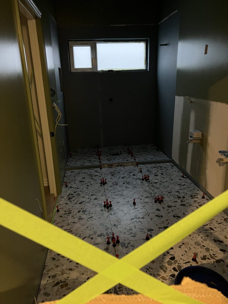 Tiling underway in a new bathroom renovation by Canterbury-based home renovation contractors, Stanton Builders.